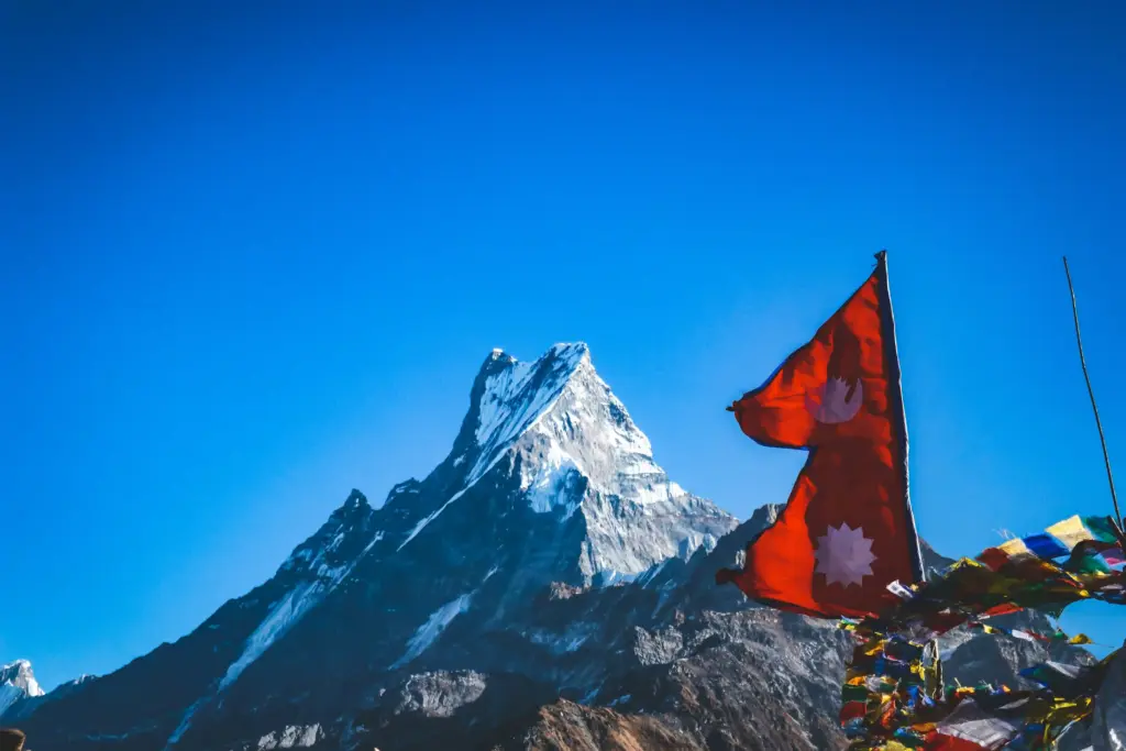 View of Mount Fishtail with fluttering fla od Nepal from Mardi Trek Route in Nepal
