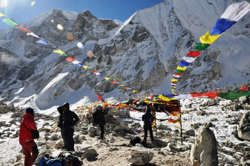 A group of trekkers crossing larkya la pass in manaslu circuit trek
