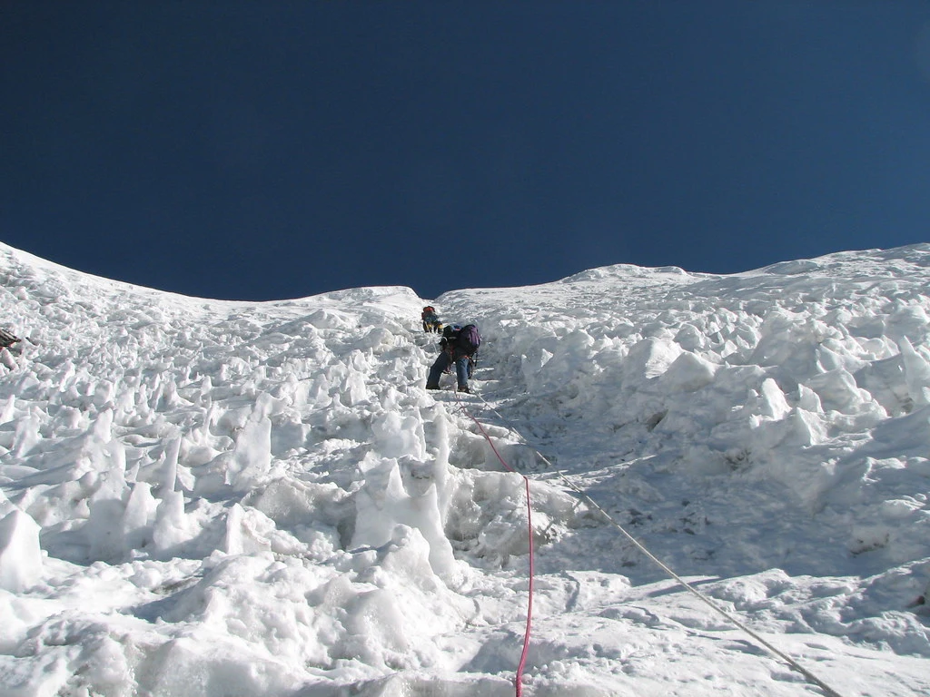 A climber summiting the island peak and headwall