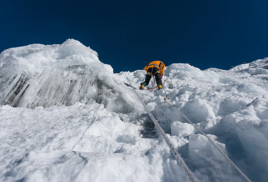 A clmiber climbing icewall if island peak