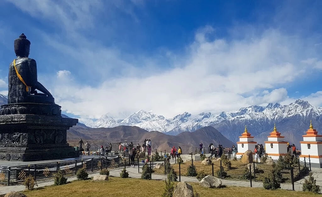 Buddha Statue near Muktinath temple with Mountain view - Annapurna Circuit Trek Route