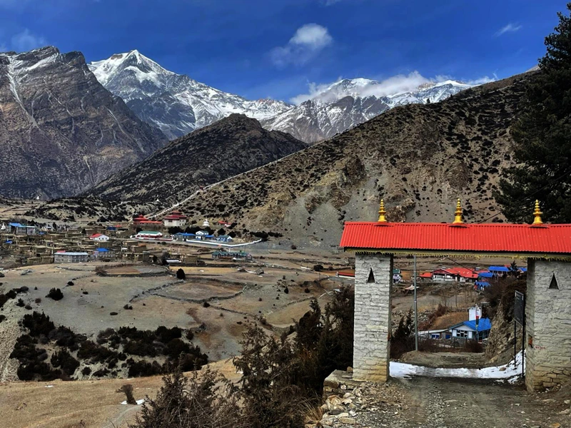 Manang overland jeep road and entry point with mountain view in the back